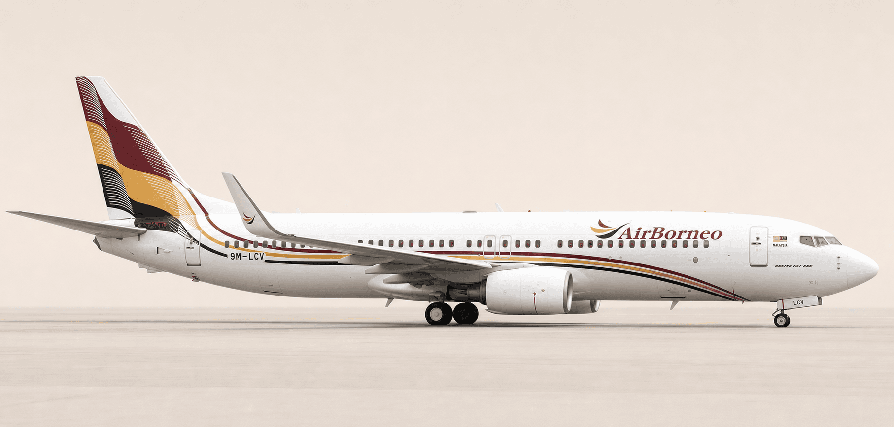 AirBorneo Boeing 737-800 9M-LCV in its burgundy, gold and black livery
